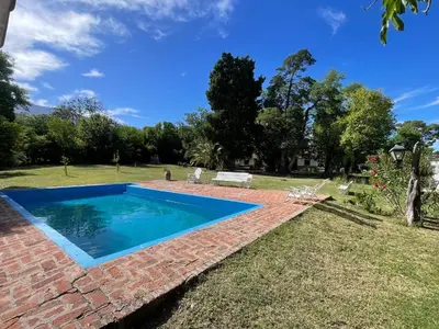 a swimming pool in the yard of a house at Casa Paine in San Javier