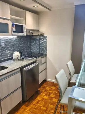 a kitchen with a sink and a stove top oven at Acogedor Depto Boutique - Centro Histórico Córdoba in Cordoba