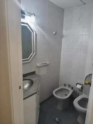a small bathroom with a sink and a toilet at Acogedor Depto Boutique - Centro Histórico Córdoba in Cordoba