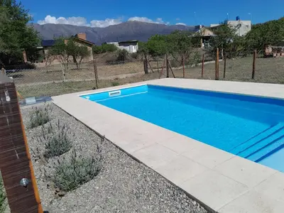 a swimming pool in the middle of a yard at Lo de guada in Los Molles
