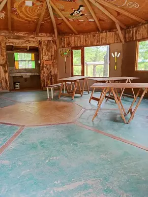 a room with picnic tables in the middle of it at La Margarita in Villa Ciudad Parque