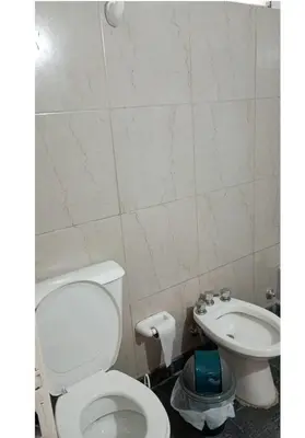 a bathroom with a toilet and a sink at El Dpto de Gabicito IV in Cordoba
