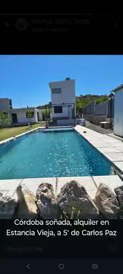 a picture of a swimming pool in front of a building at Los Bichos in Estancia Vieja