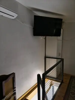 a room with a wall with a flat screen tv on the wall at Los Bichos in Estancia Vieja