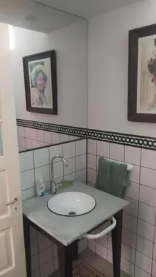 a bathroom with a sink and a mirror at La Victoria descanso Cordobes in Cordoba
