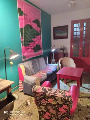 a living room with a couch and a table at La Victoria descanso Cordobes in Cordoba