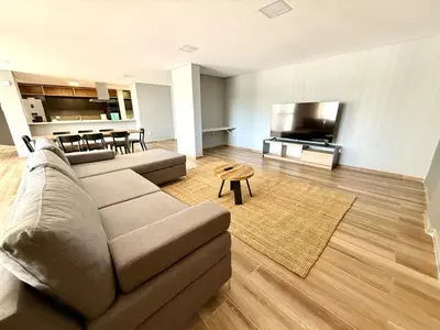 a living room with a couch and a flat screen tv at Alojamiento entero para 8 personas Belgrano Park in Cordoba