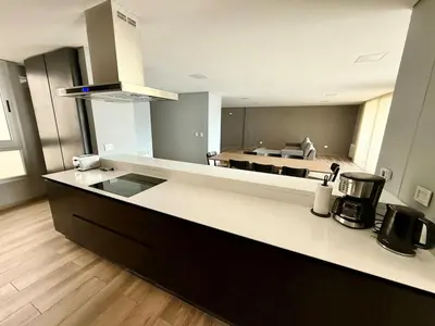a kitchen with a counter top with a stove top oven at Alojamiento entero para 8 personas Belgrano Park in Cordoba
