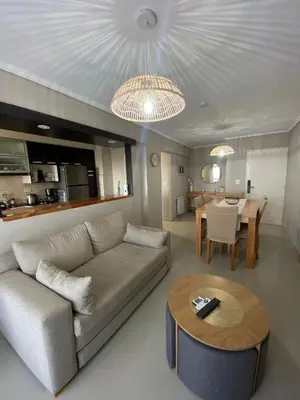 a living room with a couch and a table at Departamento en córdoba, complejo Altos de Villasol , 3 dormitorios, 2 baños in Cordoba