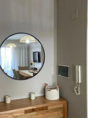 a mirror on the wall of a living room at Departamento en córdoba, complejo Altos de Villasol , 3 dormitorios, 2 baños in Cordoba