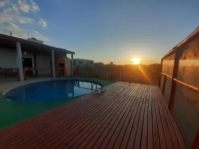 a deck with a swimming pool on top of a house at Sonidos del Silencio in Las Rabonas