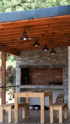 a picnic table and two benches on a patio at Finca del Campito in Villa Berna