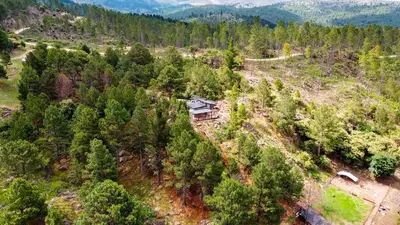 an aerial view of a house in the woods at Finca del Campito in Villa Berna
