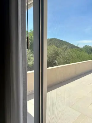 a window with a view of a mountain view at Punta Serrana in La Paisanita
