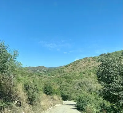 a dirt road in the middle of a mountain at Punta Serrana in La Paisanita