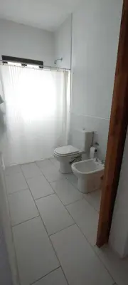 a bathroom with a toilet and a sink at Sol & Río Refugio Serrano in Villa de Las Rosas