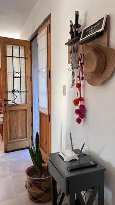 a room with a desk with a laptop on it at Sol & Río Refugio Serrano in Villa de Las Rosas