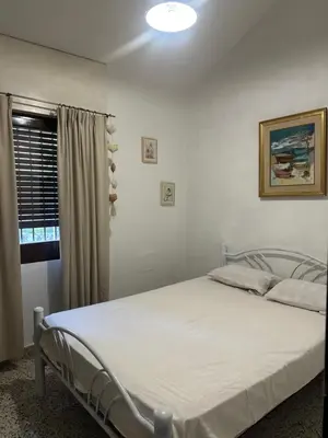 a bedroom with a bed in a room at lacasadelamontaña L&E in Villa Carlos Paz