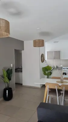 a kitchen and dining room with a table and chairs at Garage y Gimnasio Depto Ideal Villa Dolores in Villa Dolores