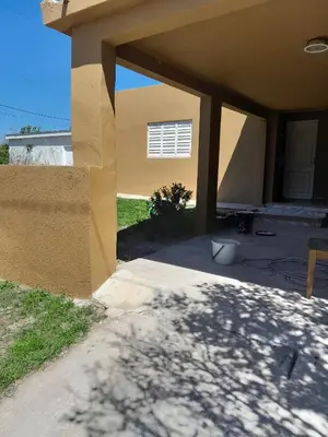 a front porch of a house with a patio at La casa de los abuelos! in Santa María