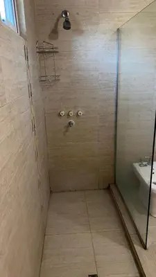 a bathroom with a shower and a sink at La Casona Dique Chico in Villa Anizacate