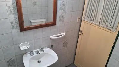 a bathroom with a sink and a mirror at Alojamiento Arroyo de los Patos in Arroyo de Los Patos