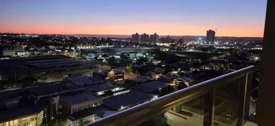 a view of a city at night from a balcony at Departamento a estrenar deluxe in Cordoba