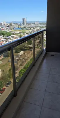 a balcony in a building with a view of a city at Departamento a estrenar deluxe in Cordoba