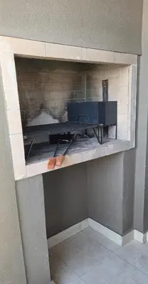 a wooden shelf with a stove in a room at Departamento a estrenar deluxe in Cordoba