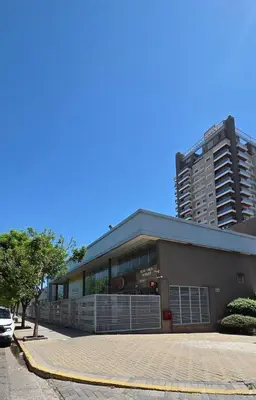 a building in front of a tall building at Departamento a estrenar deluxe in Cordoba