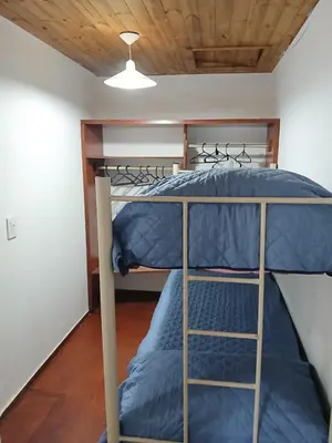 a bedroom with two bunk beds in a room at Terrazas del Kempes- Sanatorio Allende Cerro in Cordoba