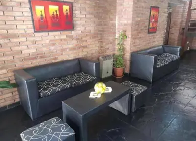 a living room with two couches and a table at New POSADA SOL in Villa Carlos Paz