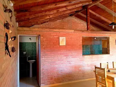 a room with a brick wall and a doorway at La Serranita in Panaholma