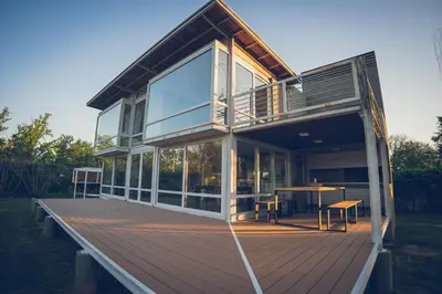 a house with a deck with a table on it at Lo de Paul in Hernando