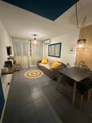 a living room with a couch and a table at Departamento Nueva Córdoba in Cordoba