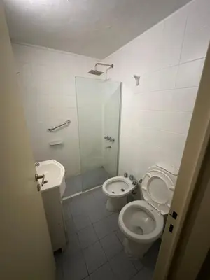 a bathroom with a shower and a toilet and a sink at Departamento Nueva Córdoba in Cordoba