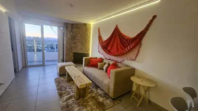 a living room with a couch and a table at Magníficas VISTAS in Cordoba