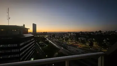 a view of a city at sunset from a building at Magníficas VISTAS in Cordoba