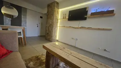 a living room with a flat screen tv on the wall at Magníficas VISTAS in Cordoba