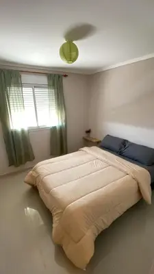 a large bed in a bedroom with a window at Departamento Barrio Cerrado Terra 2 seguridad 24h pileta in Cordoba