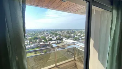 a view of a city from a window at Departamento Barrio Cerrado Terra 2 seguridad 24h pileta in Cordoba