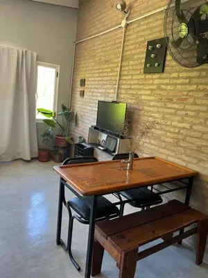 a desk with a computer on it in a room at Terrazas del Pinar, Loft con pileta exclusiva en bosque serrano in Villa Ciudad de America