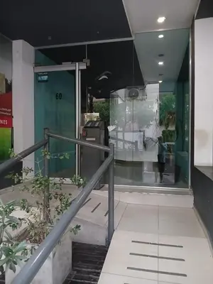a person walking down a staircase in a building at Departamento Baratti's in Villa Carlos Paz