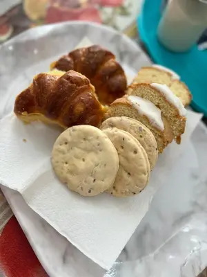 a plate of food with pastries and crackers on it at La casita the Aye in Villa Carlos Paz