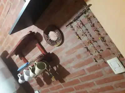 an overhead view of a brick wall with vases at Casa Sol Y Rio, LOFT MONOAMBIENTE in Mina Clavero