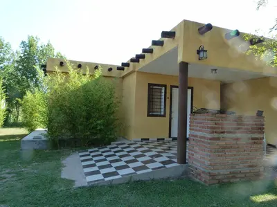 a house with a checkered floor in front of it at Yerba Buena casas de campo - Nono in Nono