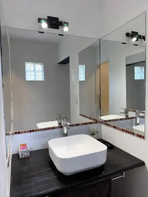 a bathroom with a white sink and a mirror at Casa en Estancia Vieja a 5 min del centro de Carlos Paz in Villa Carlos Paz