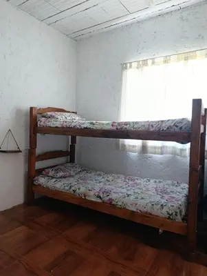 two bunk beds in a room with a window at La Morada de sus Sueños Caeiro in Bialet Massé
