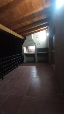an empty room with a light on the ceiling at Balcones del Rio in Santa Rosa de Calamuchita