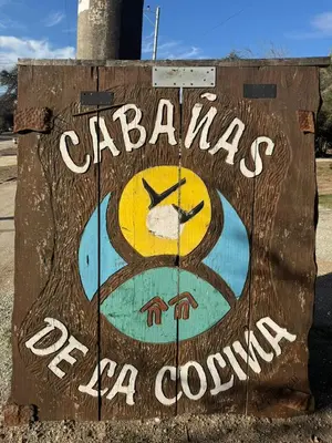 a sign that says cabanas for a cowboy at Cabañas De La Colina in Villa General Belgrano